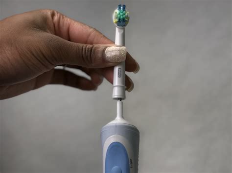 how to change battery in oral b toothbrush